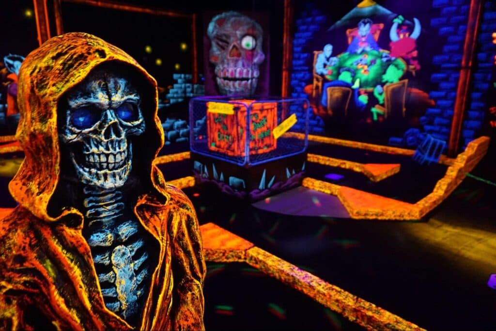 MotoBros members at a glow-in-the-dark mini golf event