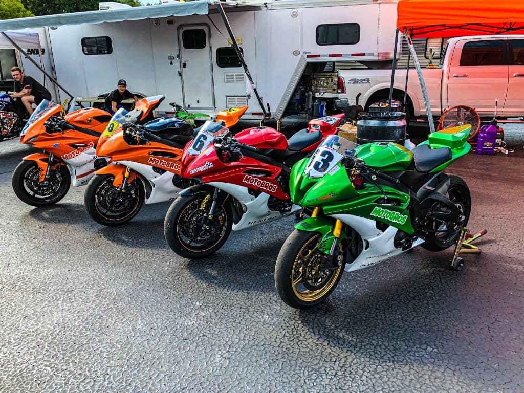 Sportbikes lined up in the MotoBros paddock ready for dyno and track prep